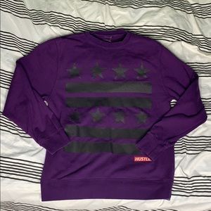 A long purple hustle sweater